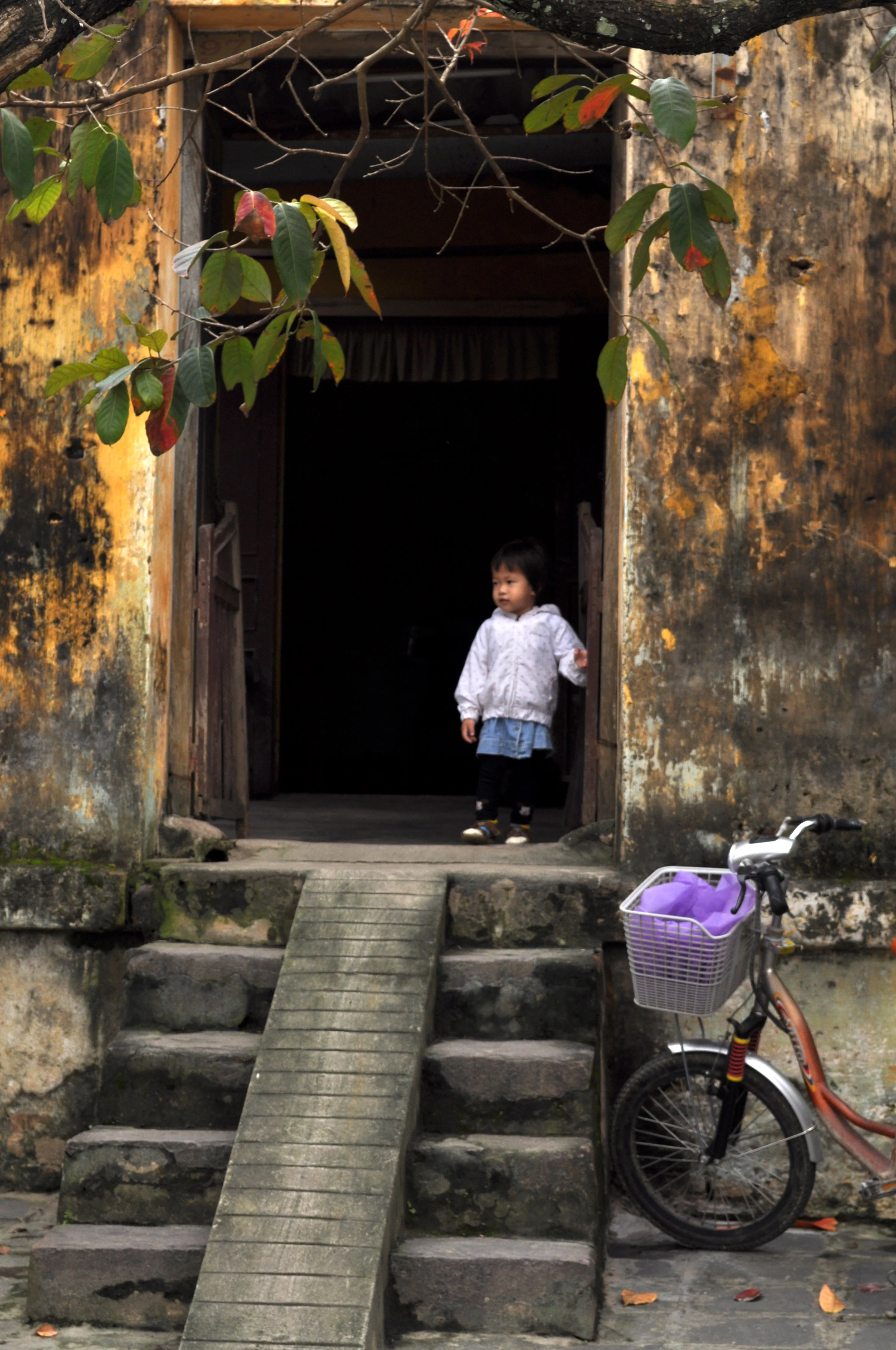 Small Child in Hoi An Doorway, Vietnam