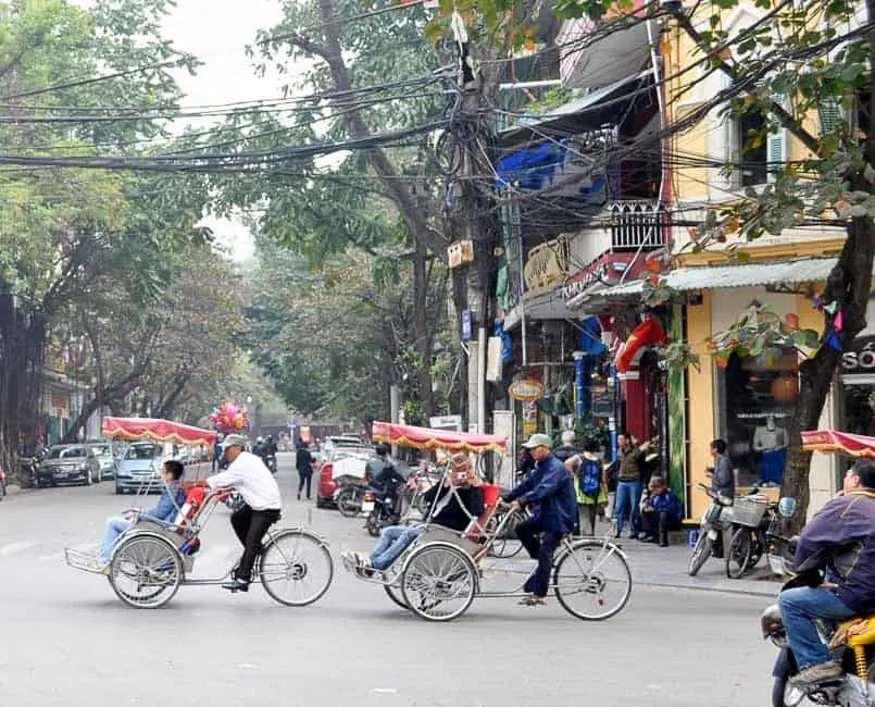 Crossing the road in Hanoi's old quarter, Hanoi, Vietnam Stock