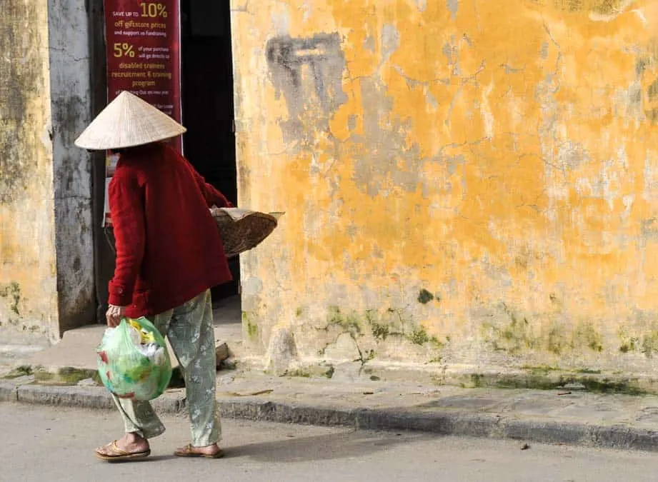 Vietnamese woman and yellow wall