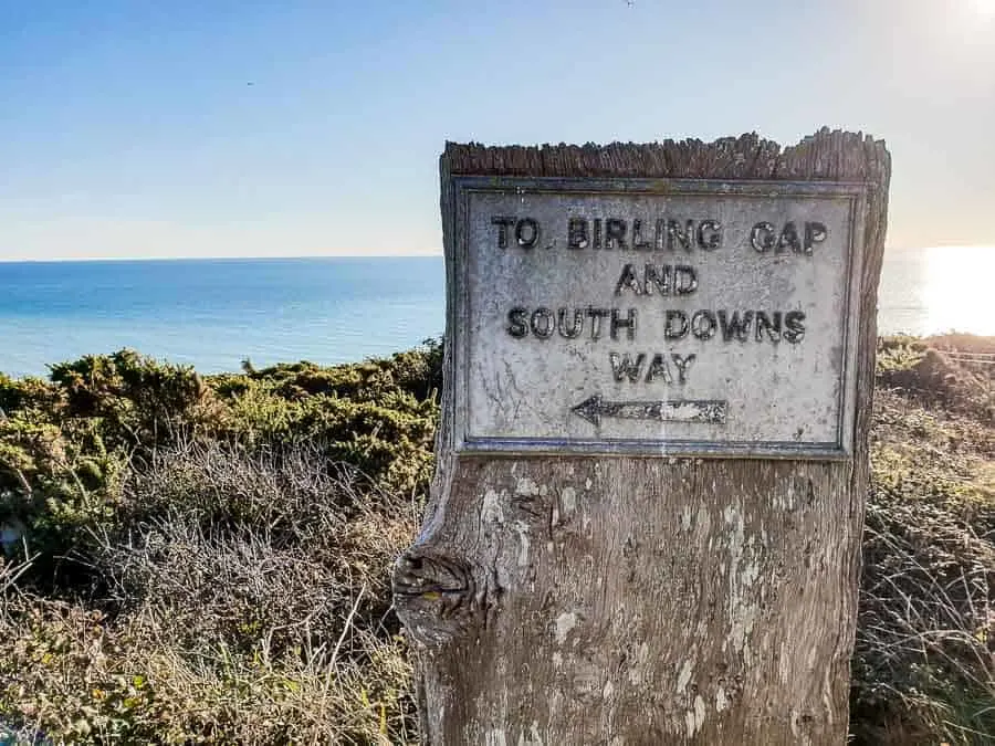 Birling Gap and South Downs Way sign with sea and sky in the background