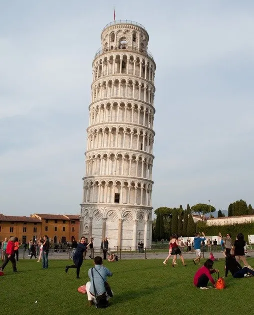 Tourists posing at The Leaning Tower of Pisa