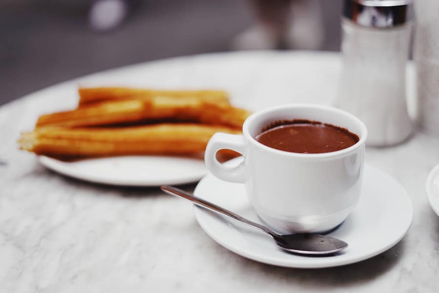 Cup of hot chocolate and churros