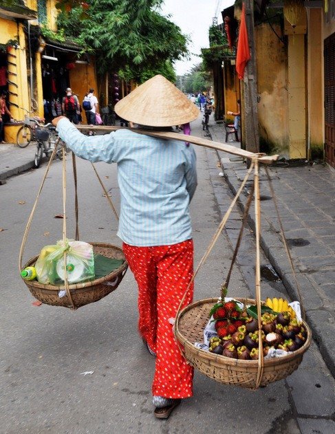 vietnamese woman with baskets