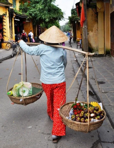 vietnamese woman with baskets