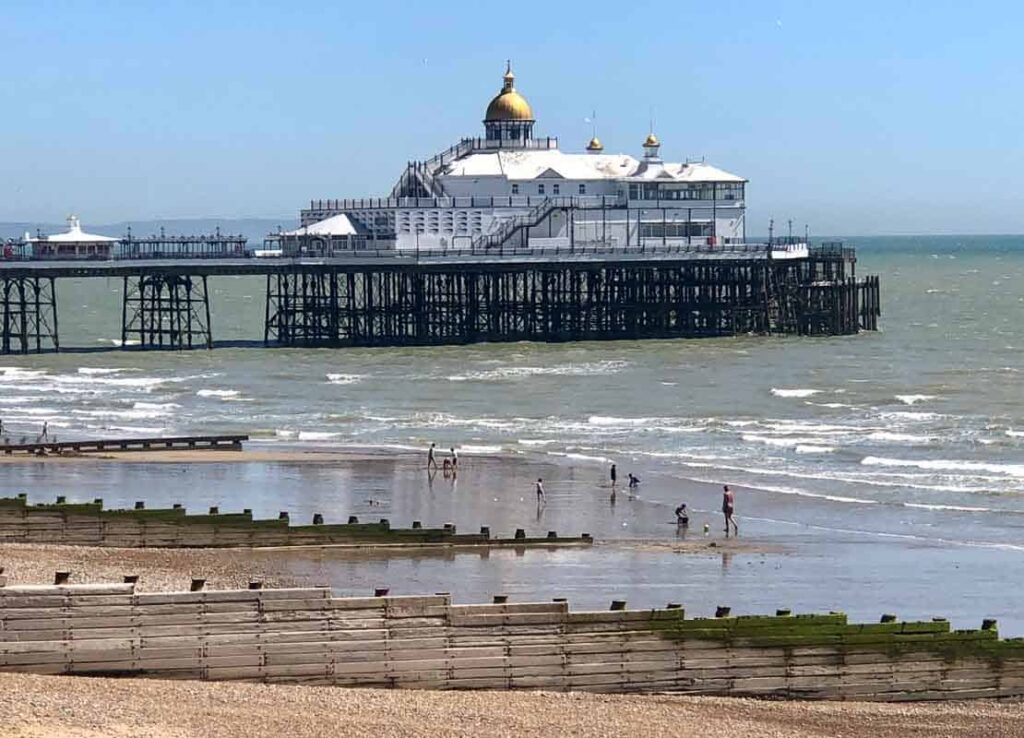 Eastbourne Pier and beach on sunny day
