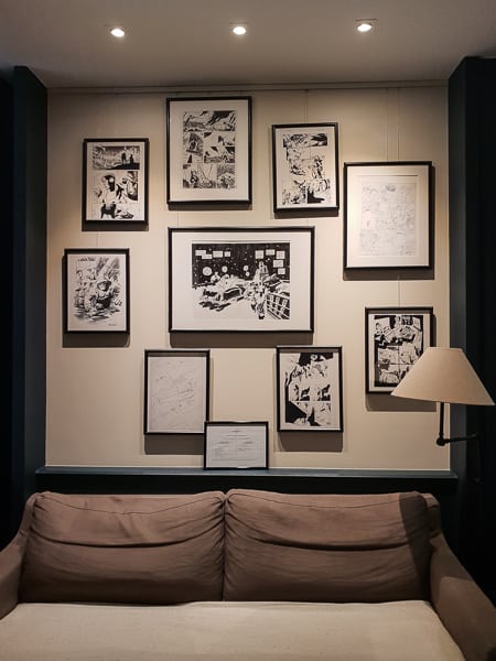 picture wall with framed cartoons