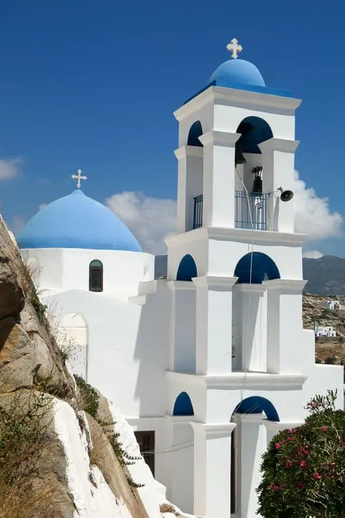 Blue domed church and white tower in Ios