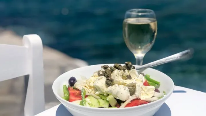 Greek saland and glass of wine