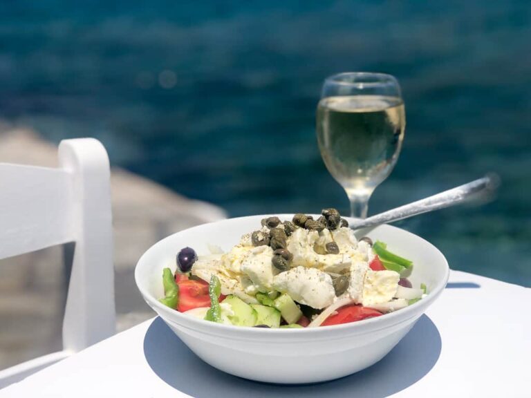 Greek saland and glass of wine