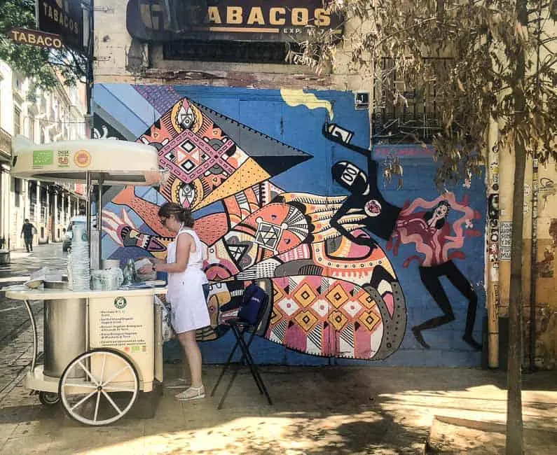 Horchata stall in Valencia next to a graffiti wall