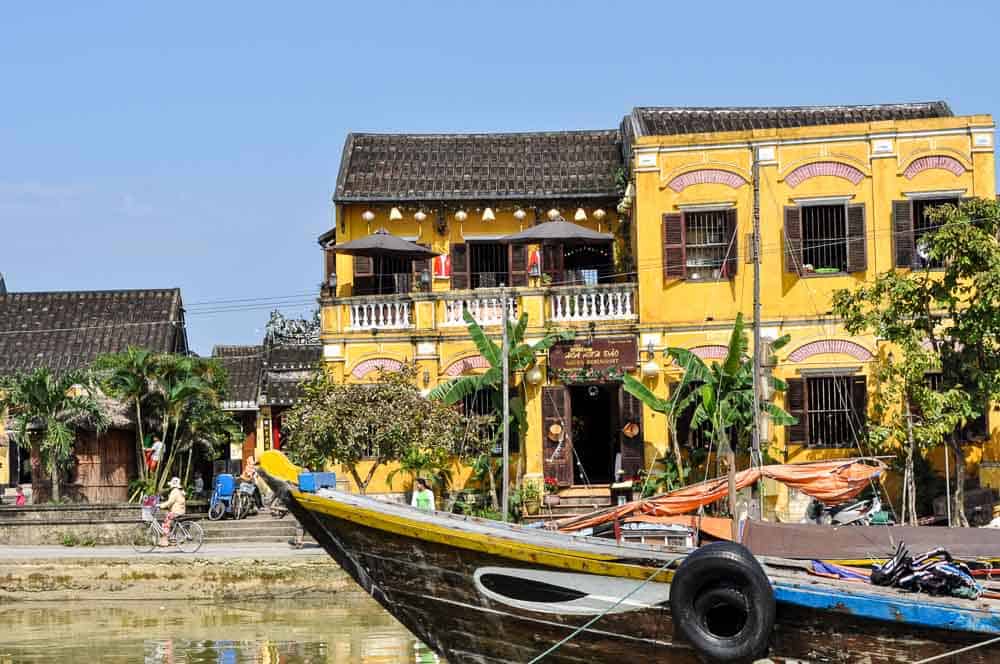 Yellow houses and boats on the Thu Bon River, Hoi An