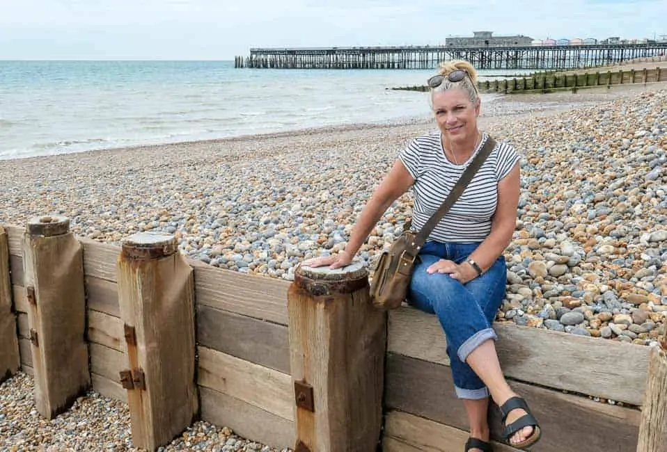 woman wearing leather cross body bag at the beach