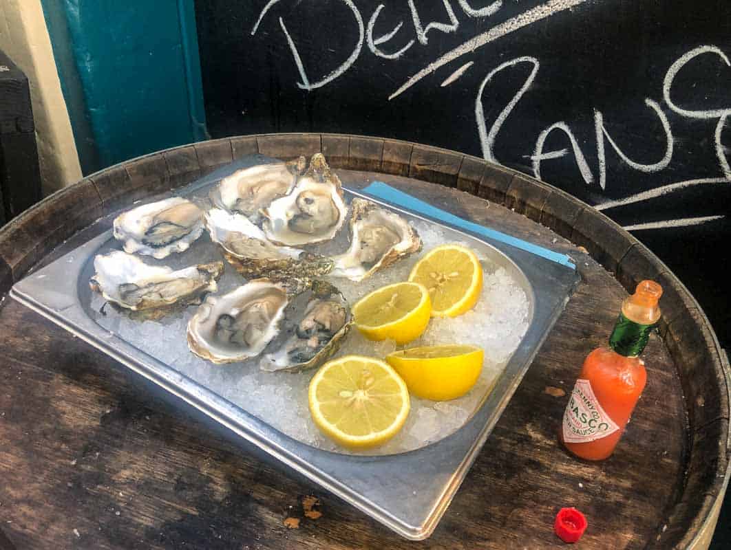 Oysters from Lindisfarne with lemon slices and tabasco sauce