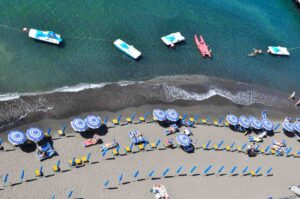 Leonelli's Beach in Sorrento with blue striped parasols
