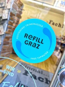 Refill Graz - water refill sitcker on shop window in Graz