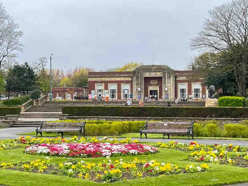 Art Deco Cafe at Stanley Park Blackpool with spring flowers in the gardens at the front