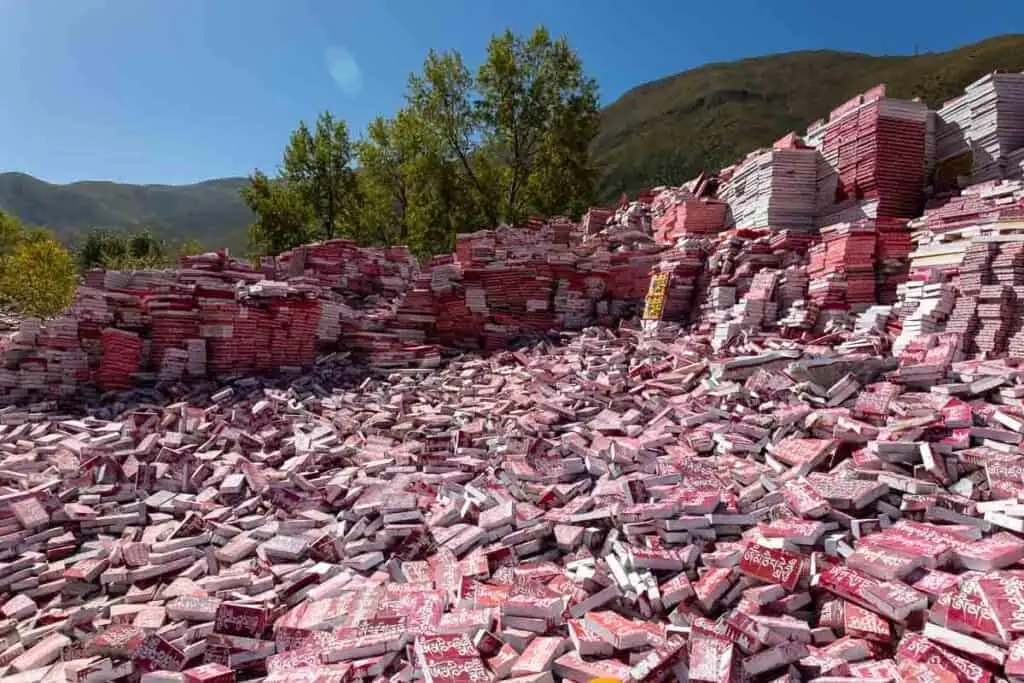 A vast pile of red and white mani stones with Tibetan script at Jiana Mani Stone City.
