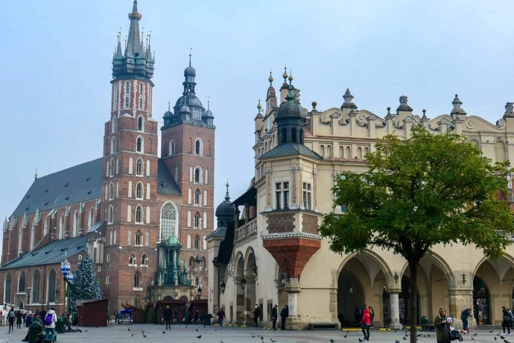 The twin towers of St Mary's Basilica in Krakow stand next to the historic Cloth Hall