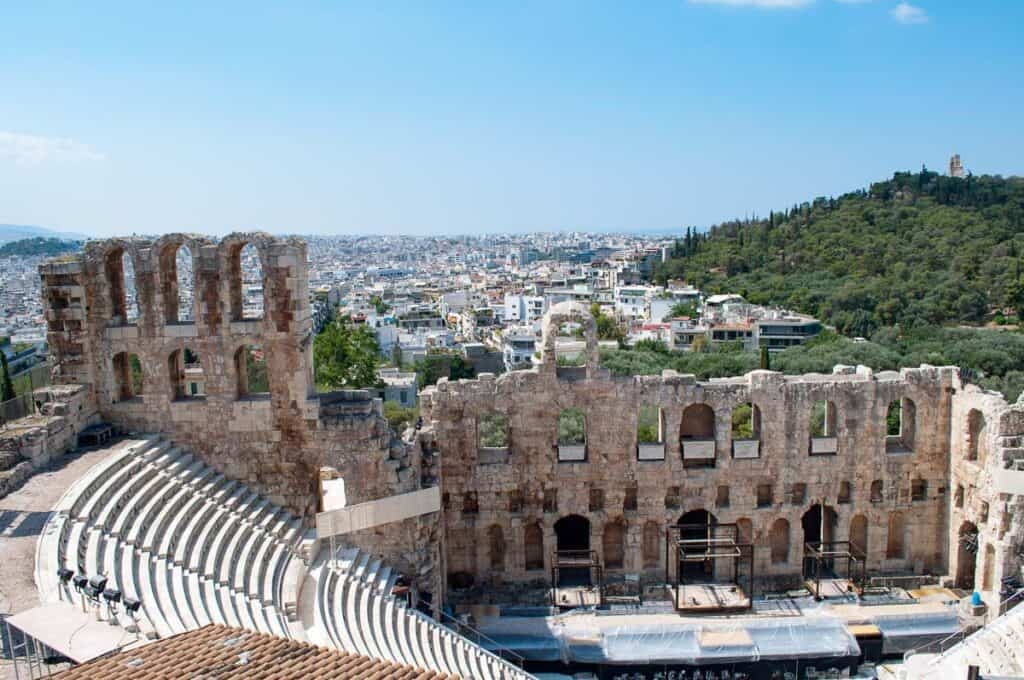 Looking over the Odeon of Herodes Atticus amphitheatre with a view of Athens in the background
