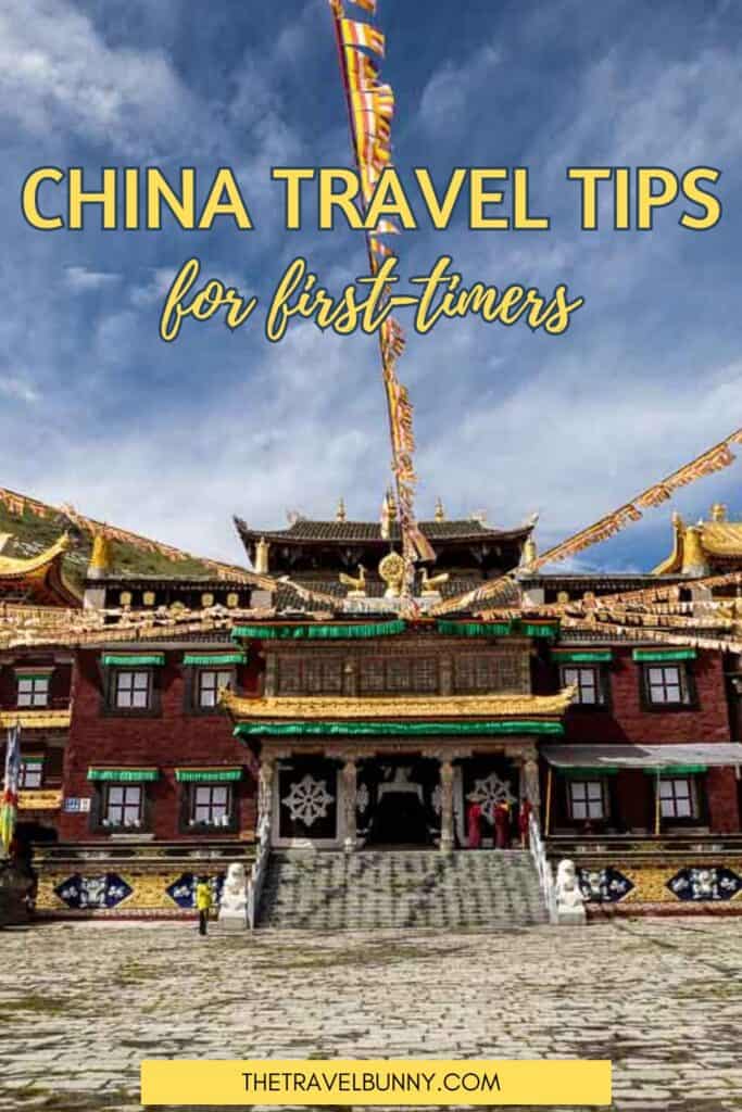 A monastery with prayer flags agains a blue sky. Text overlay reads China travel tips for first timers.