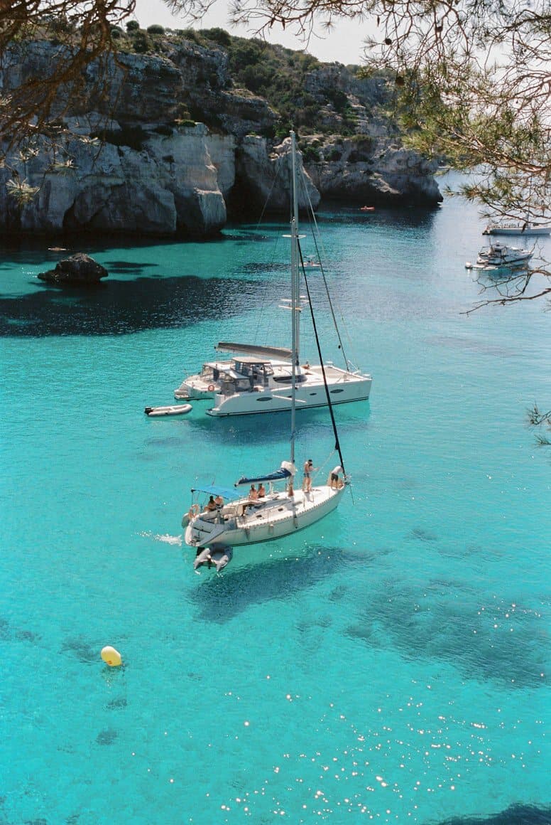 Turquoise cove with rocky cliffs in Menorca